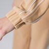Women’s beige 100% cotton sweatshirt jacket with white contrast stripes and ribbed cuffs