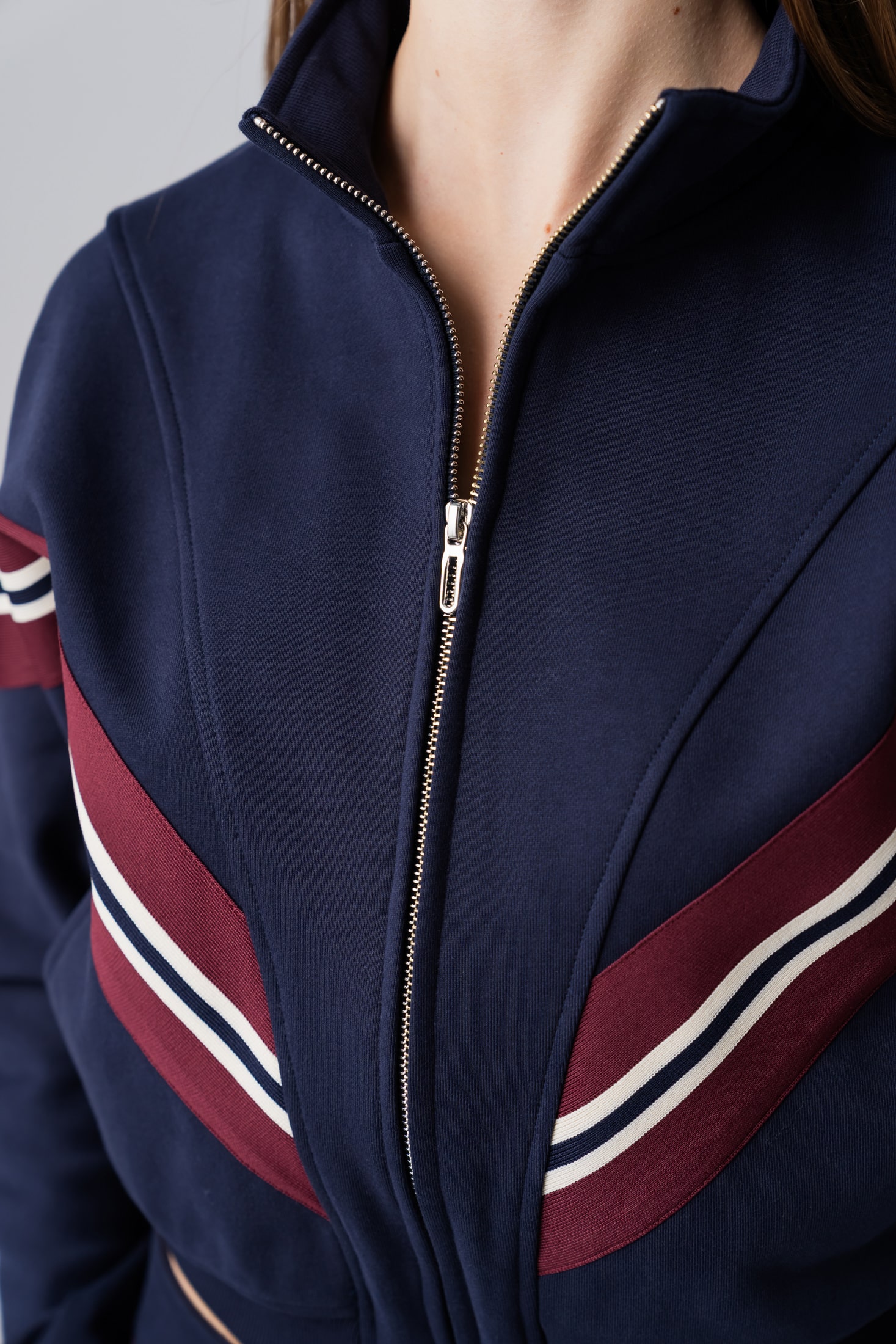 Women's navy zipper sweatshirt with red and white stripes made from 100% cotton