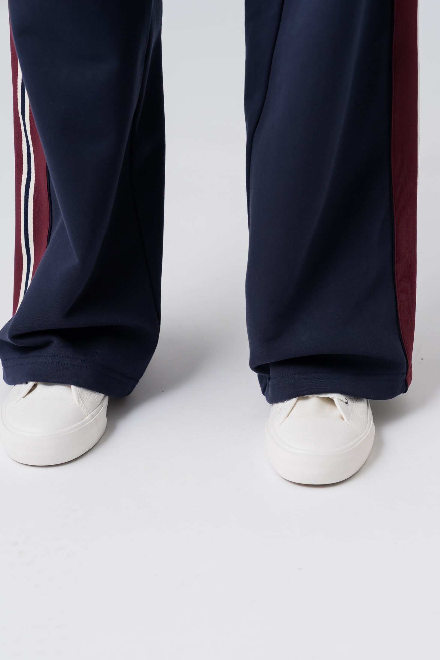 Women's wide leg navy sweatpants with red and white stripes made from 100% cotton