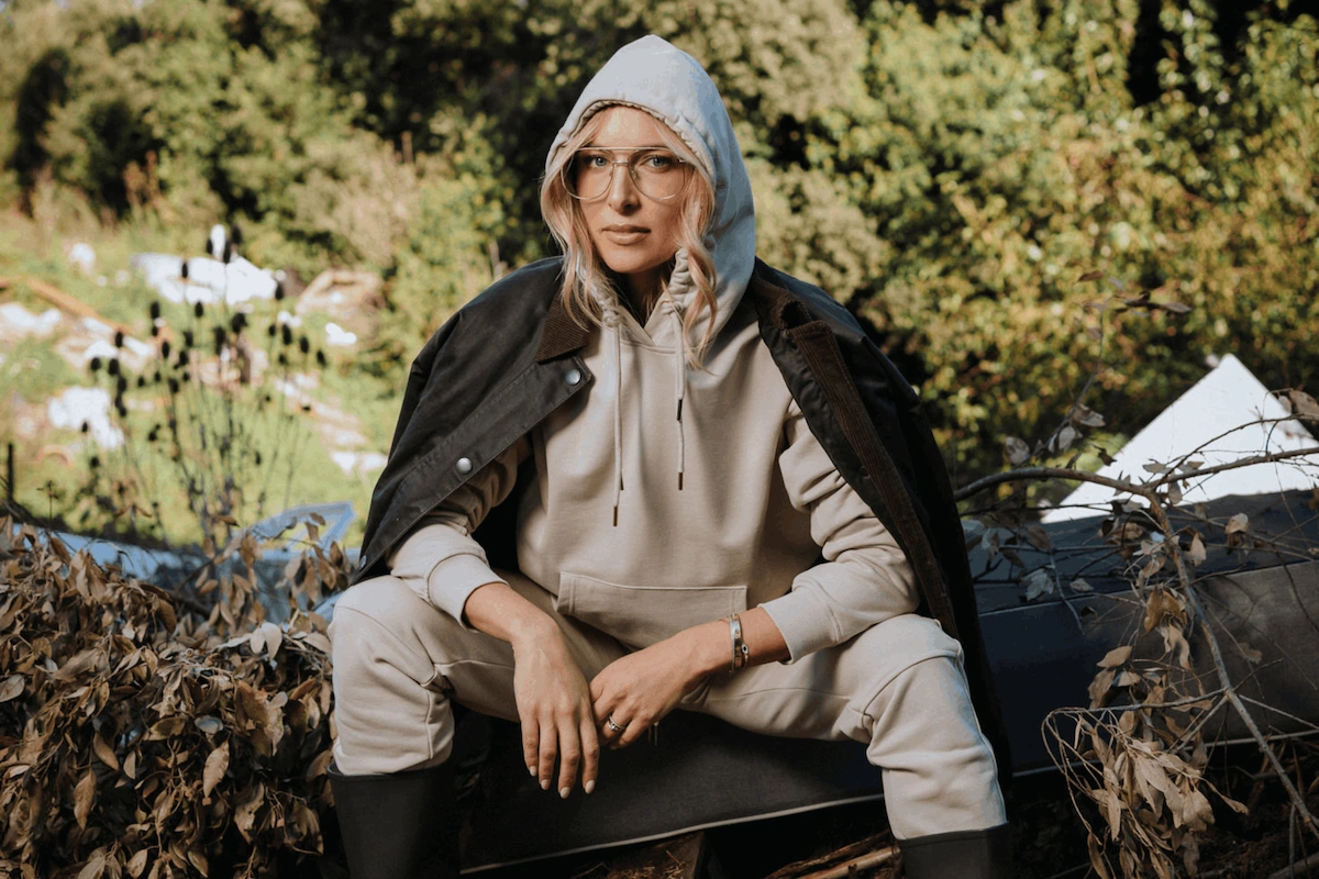 Woman wearing comfortable cotton loungewear outdoors representing durability in responsible clothing.